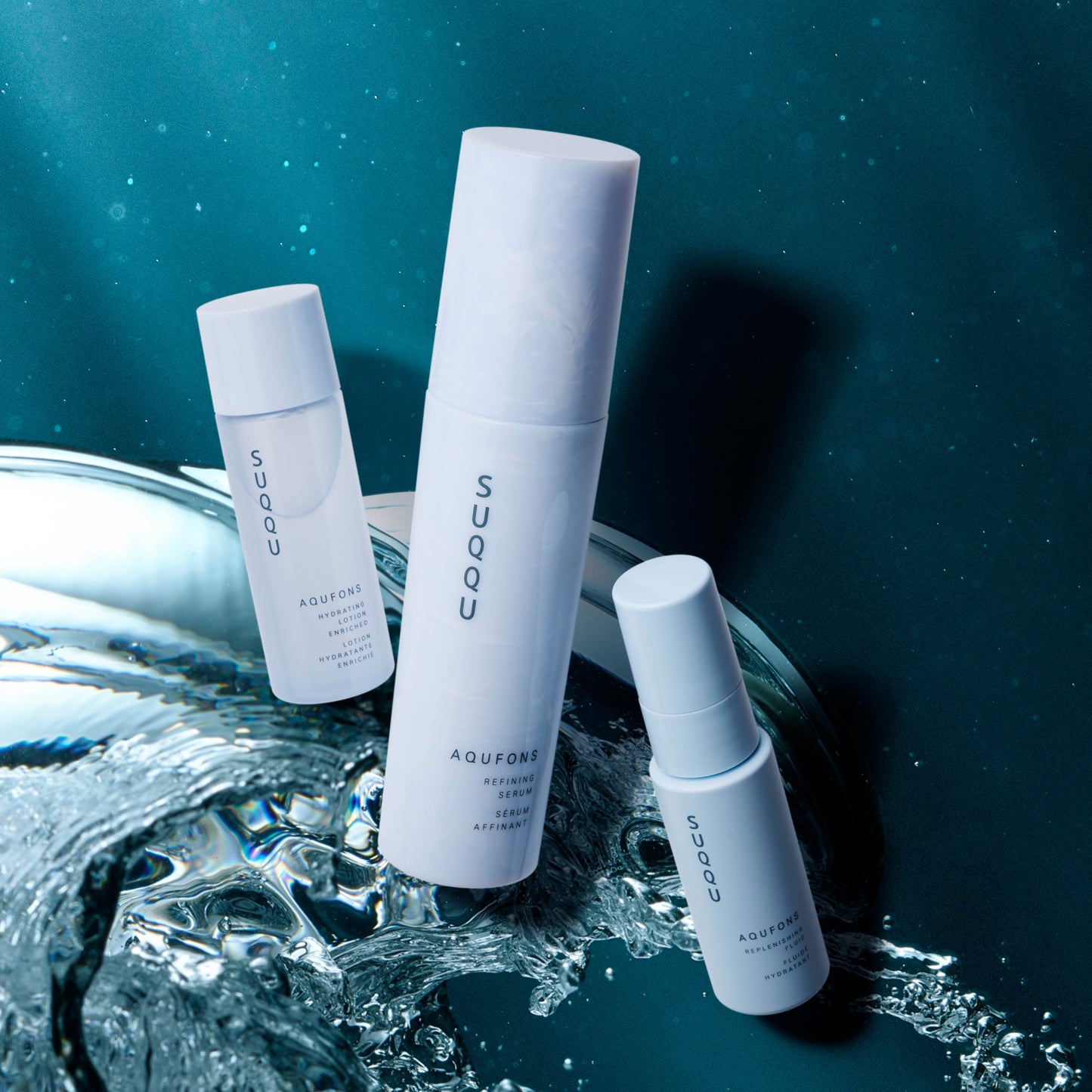SUQQU Aqufons The Kit - Three Aqufons skincare range products against bubbles background