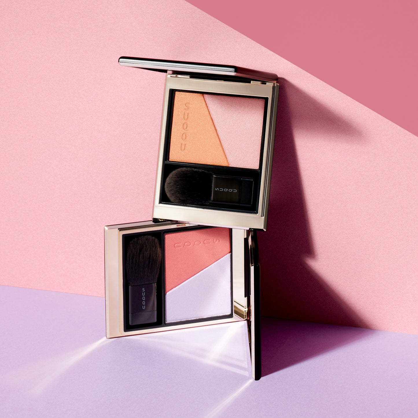 SUQQU Blurring Color Blush 110 and 111, two blush and highlighter palettes open on plain background.