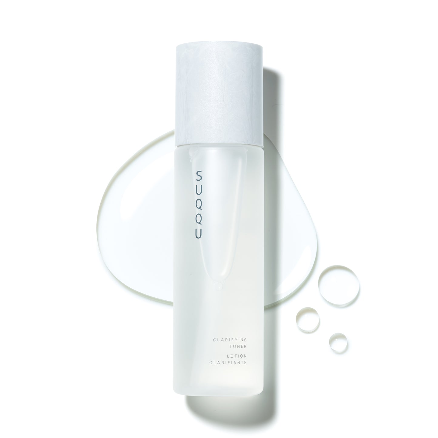 SUQQU Clarifying Toner skincare product on plain background with liquid texture swatch.