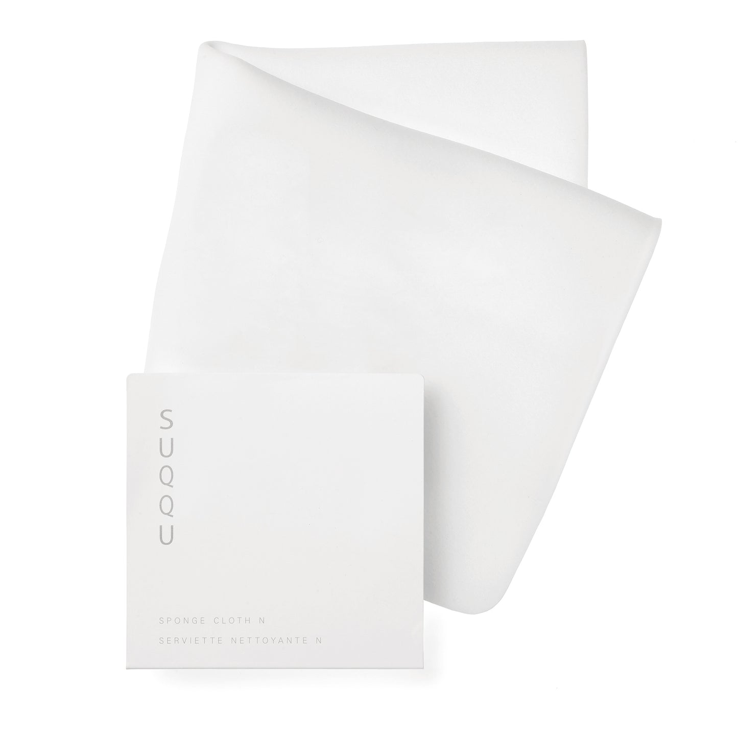 SUQQU Designing Massage Cream Cleansing Cloth with packet on plain background.