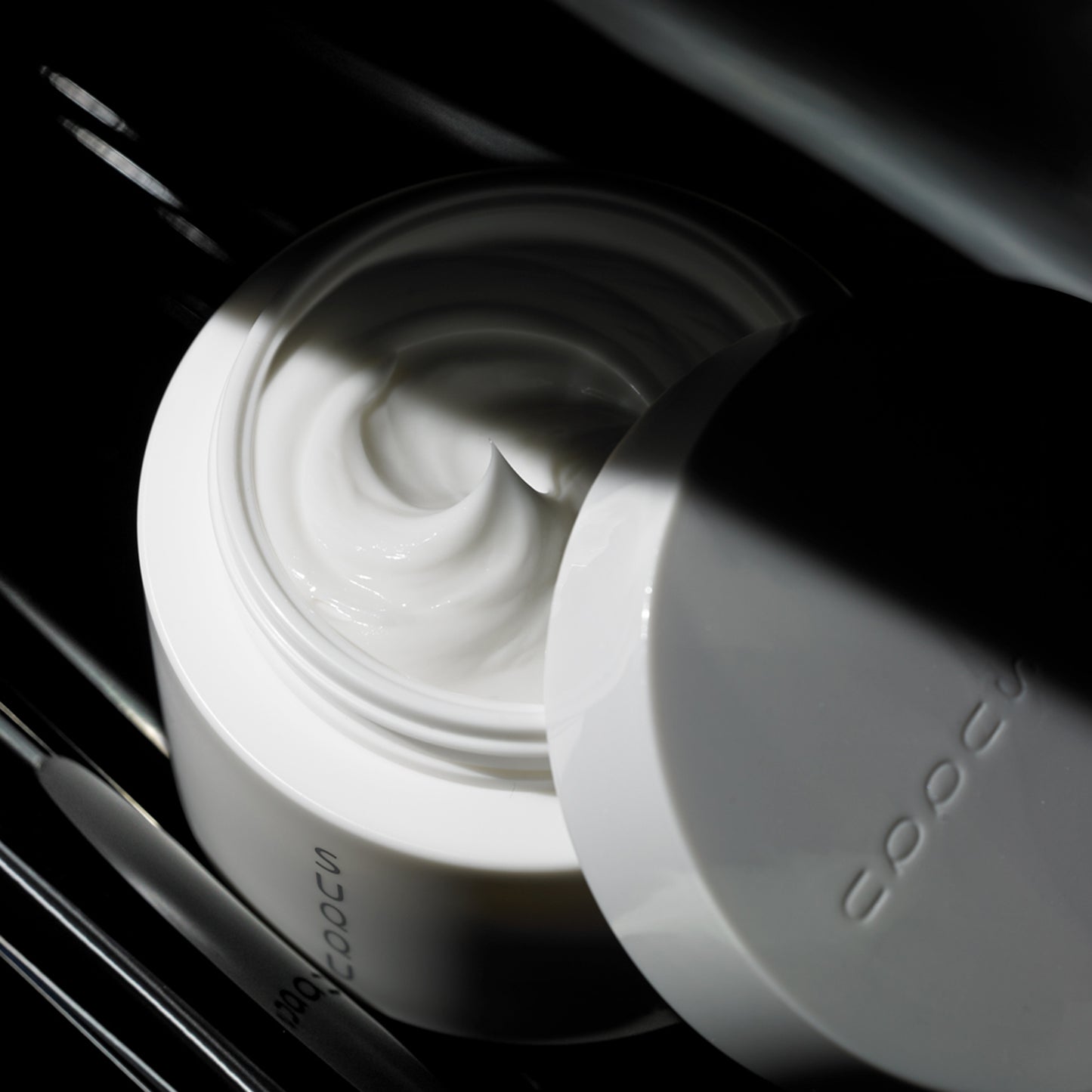 SUQQU Designing Massage Cream tub with lid open showing cream.