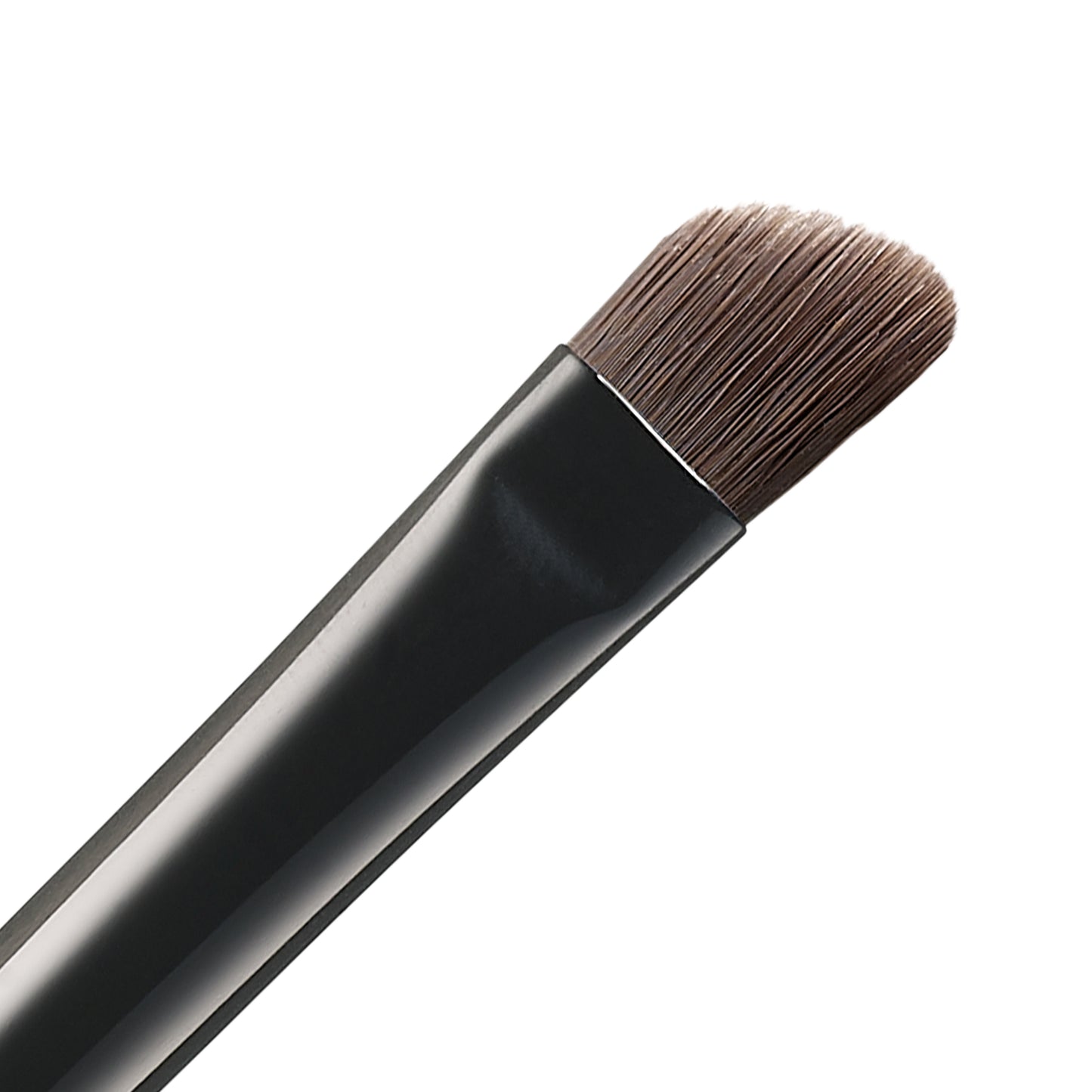 SUQQU Eyebrow Brush Large Japanese synthetic artisan professional grade make up brush bristle close up on plain background.
