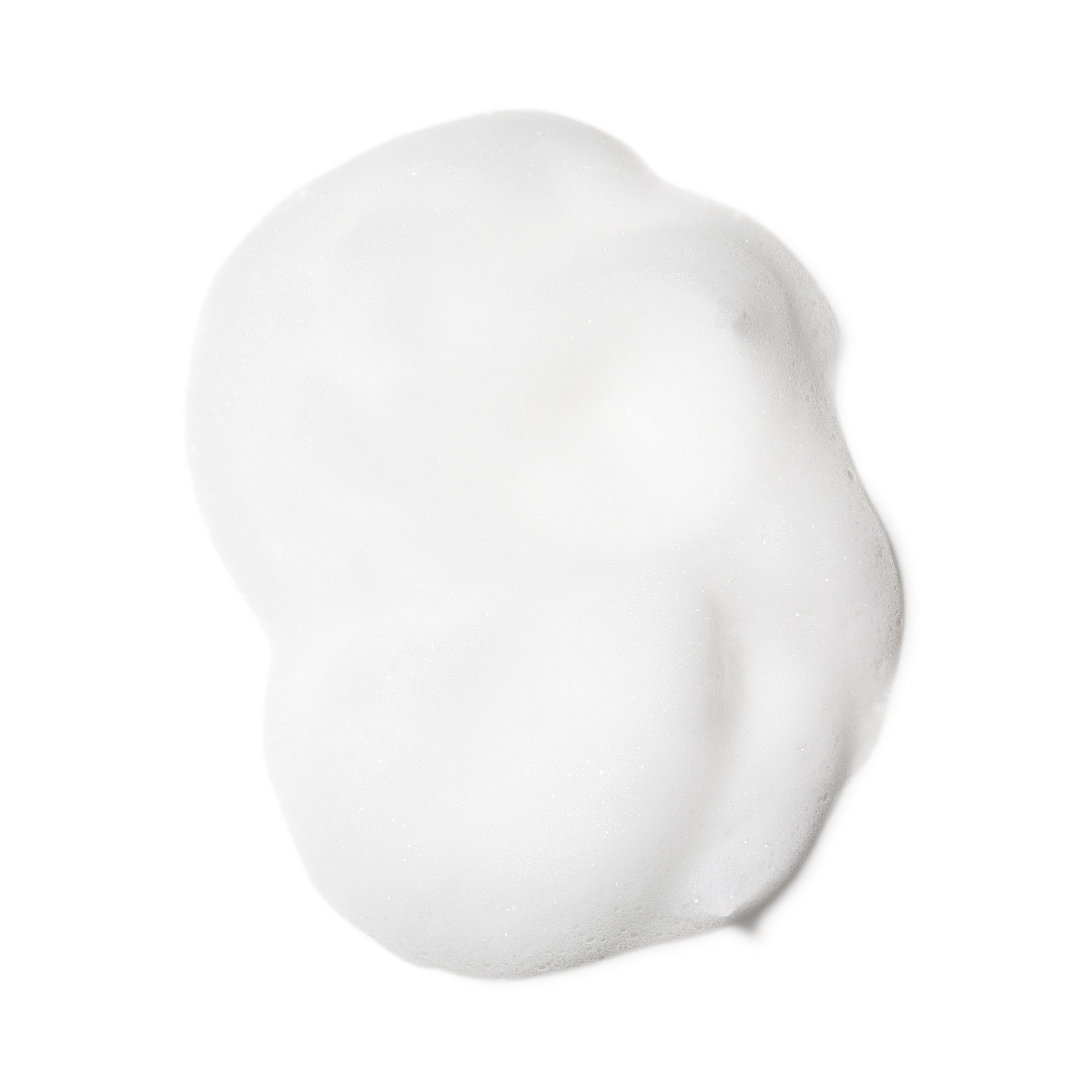 SUQQU Gentle Whip Wash luxury foam texture of face cleansing skincare product on plain background.