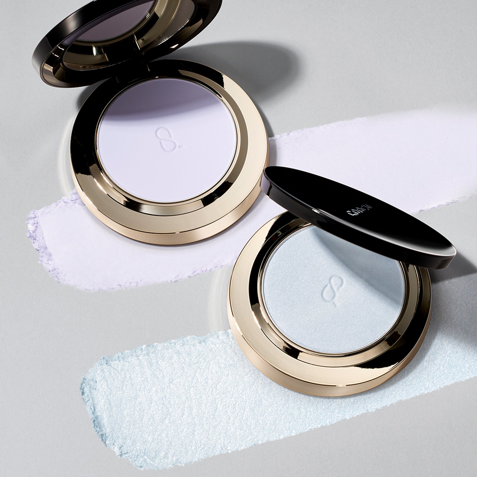 SUQQU Setting Powder palettes with texture on table.