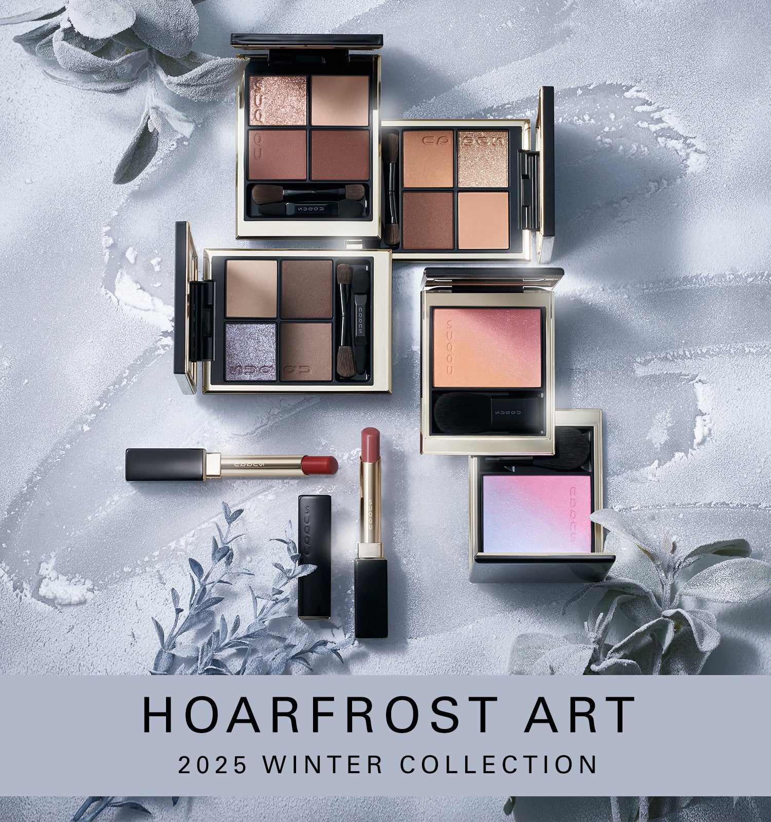 SUQQU Hoarfrost Art Winter Colour Collection 2025 product group on frosted plant background. Multiple makeup palettes and lipsticks laid out together.