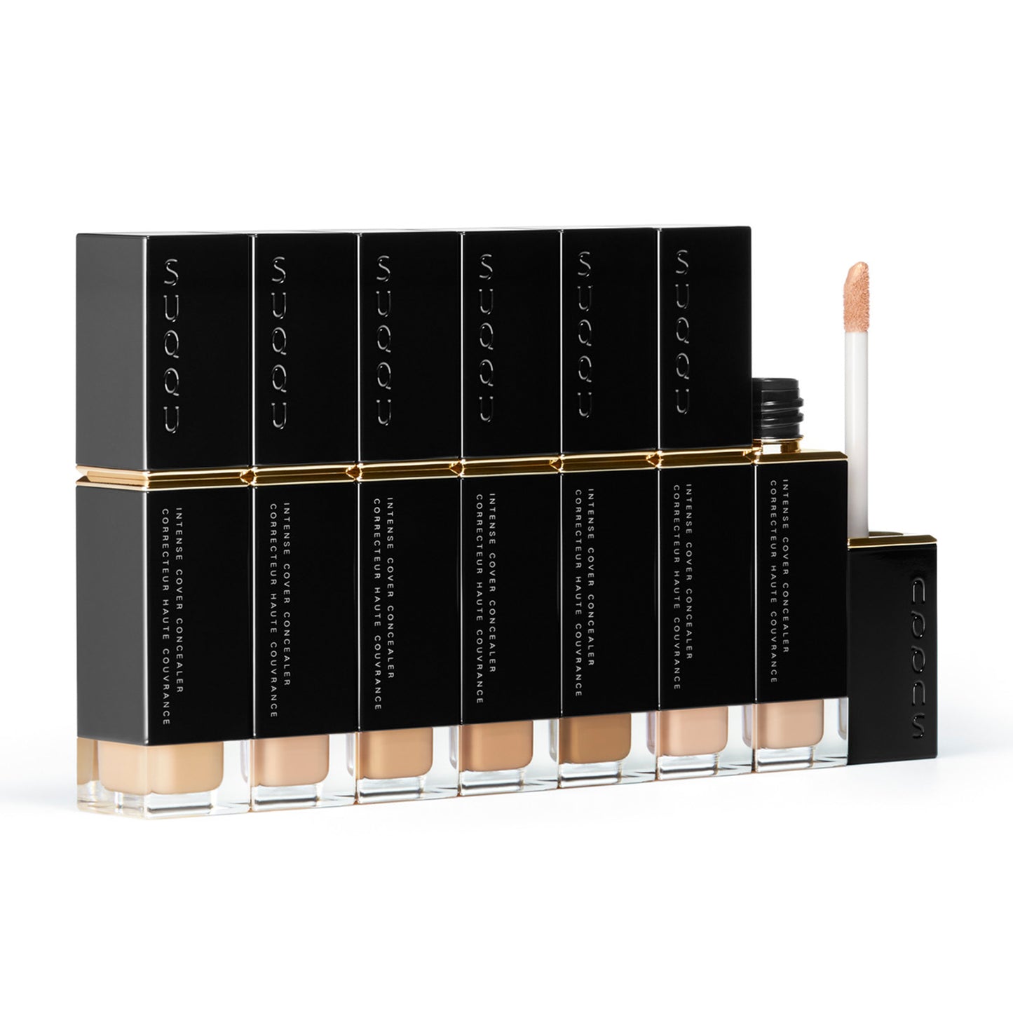 Seven shades of SUQQU Intense Cover Concealer base make up products with one brush tip shown.
