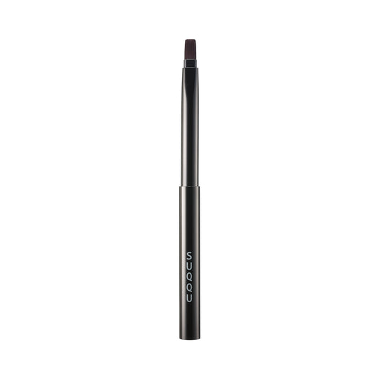 SUQQU Lip Brush Japanese vegan friendly synthetic artisan professional make up brush on plain background.