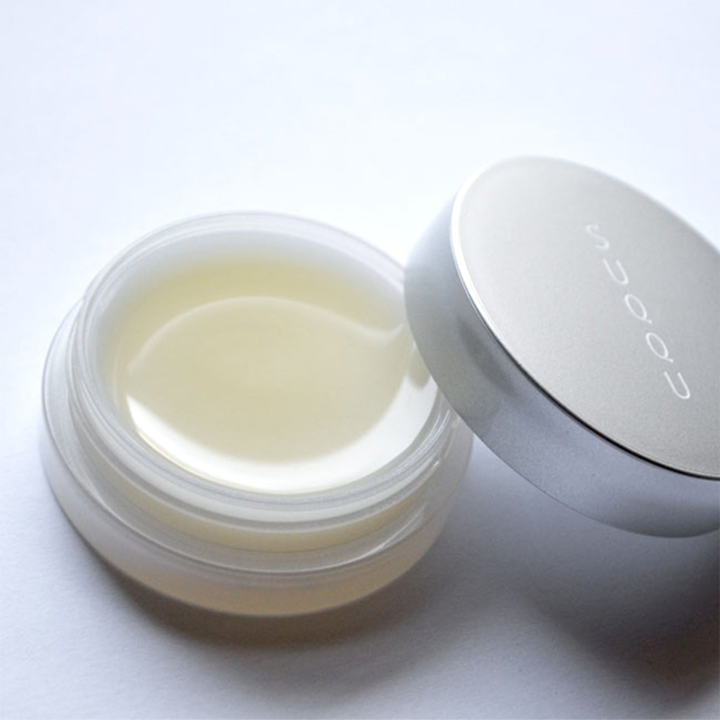 SUQQU Lip Concentrate Balm luxury Japanese skincare moisturising pot with lid open.