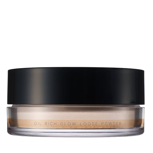 SUQQU Oil Rich Glow Loose Powder face powder make up product pot on plain background.