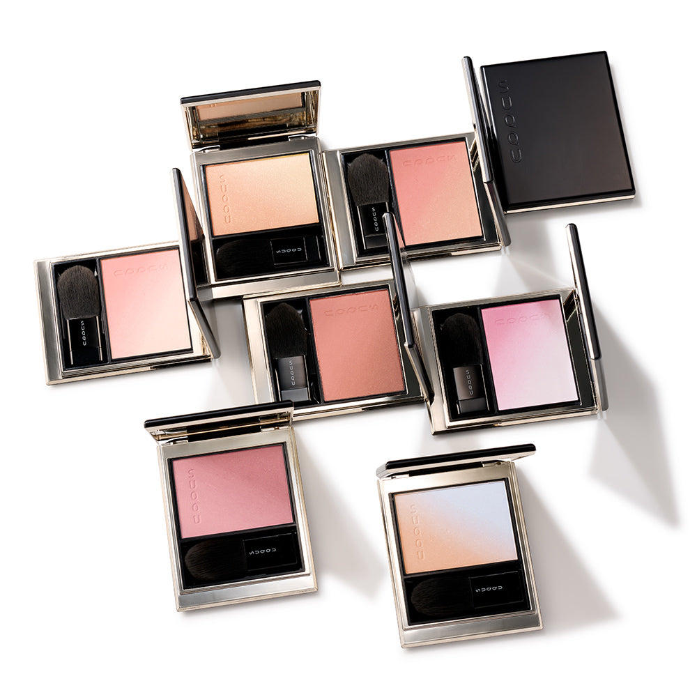 Seven Blurring color blush make up palette products open on a table.