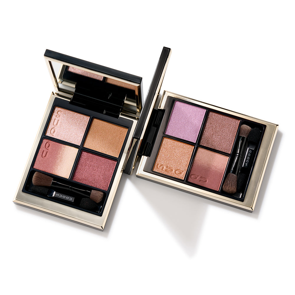 Two Signature Color Eyes eyeshadow palettes open on a table.