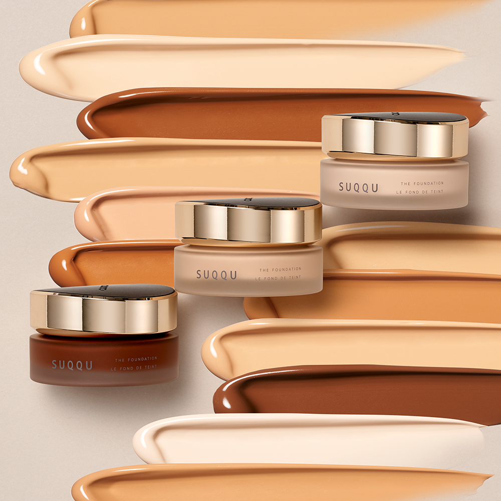 SUQQU Three The Foundation products and swatches textured background