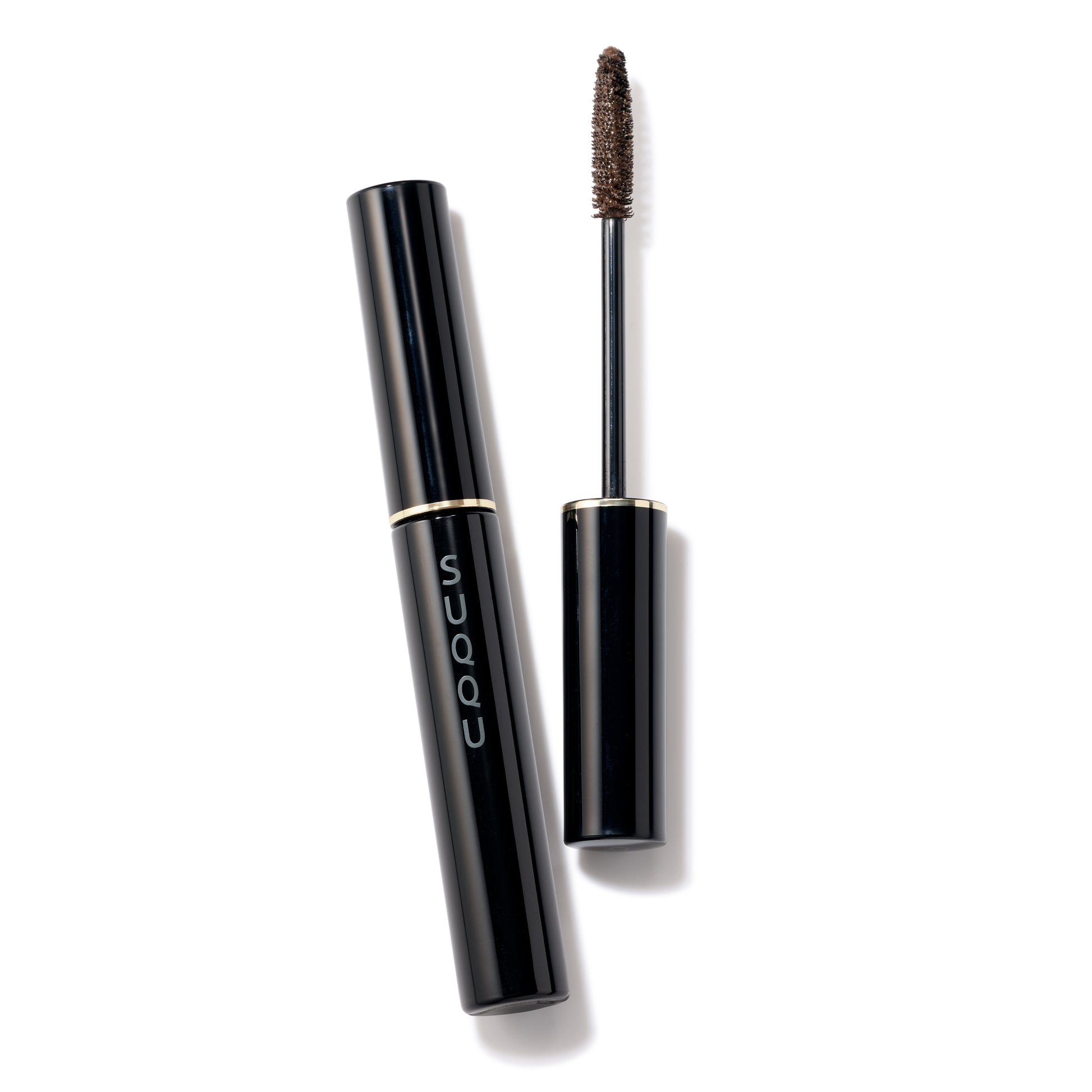 SUQQU Setting Eyebrow Gel 01 clear brown make up product with wand open and cap closed on table.