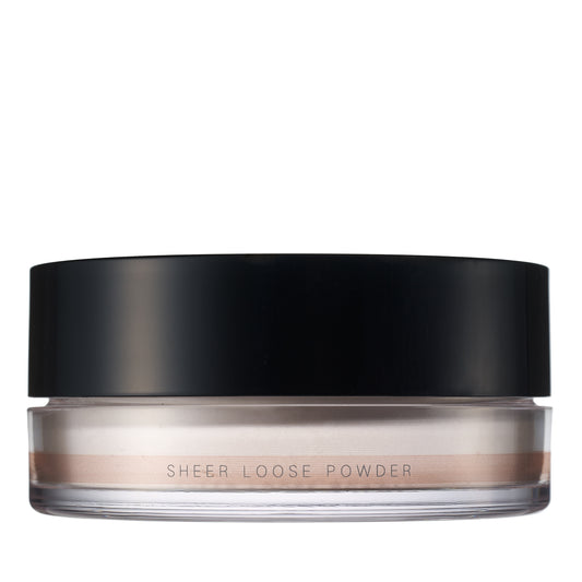 SUQQU Sheer Loose Powder face powder make up product pot on plain background.