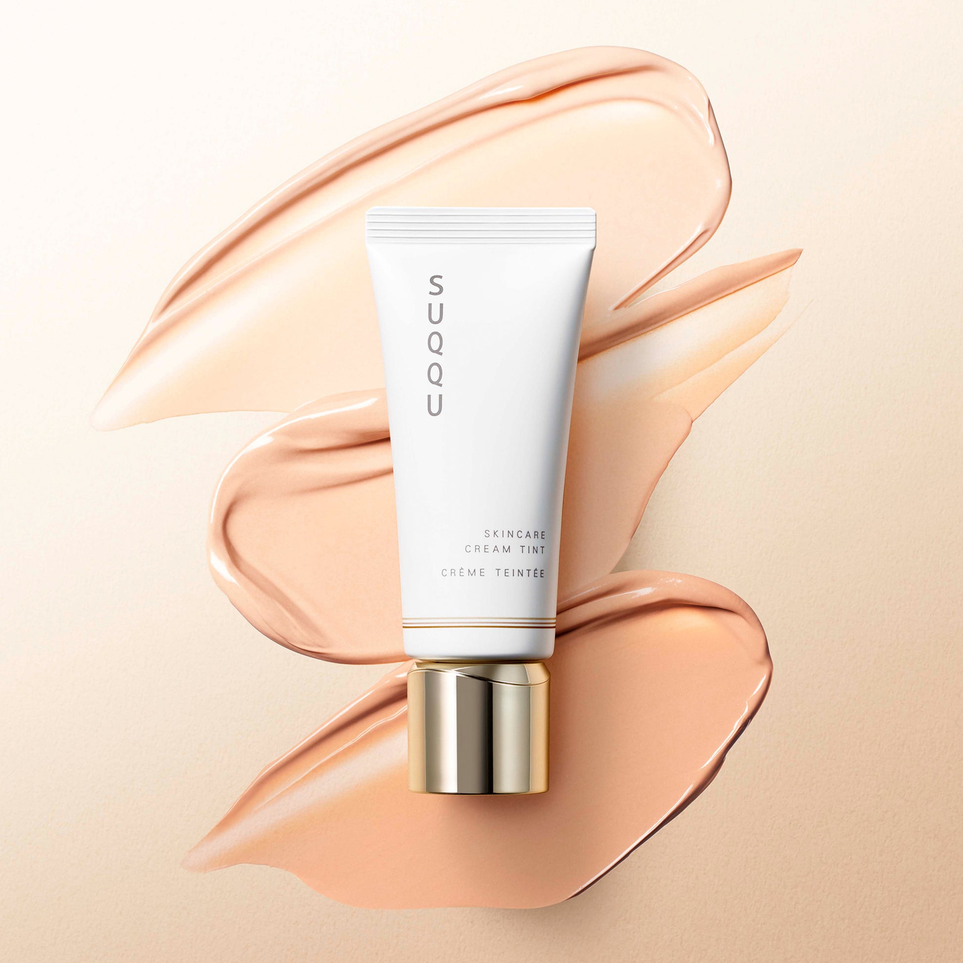 SUQQU Skincare Cream Tint foundation tube with colour texture swatches.