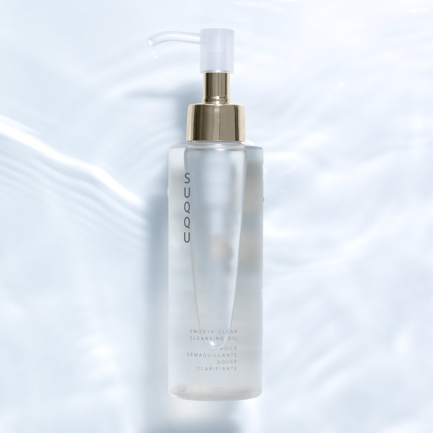 Smooth Clear Cleansing Oil product pump bottle on water background