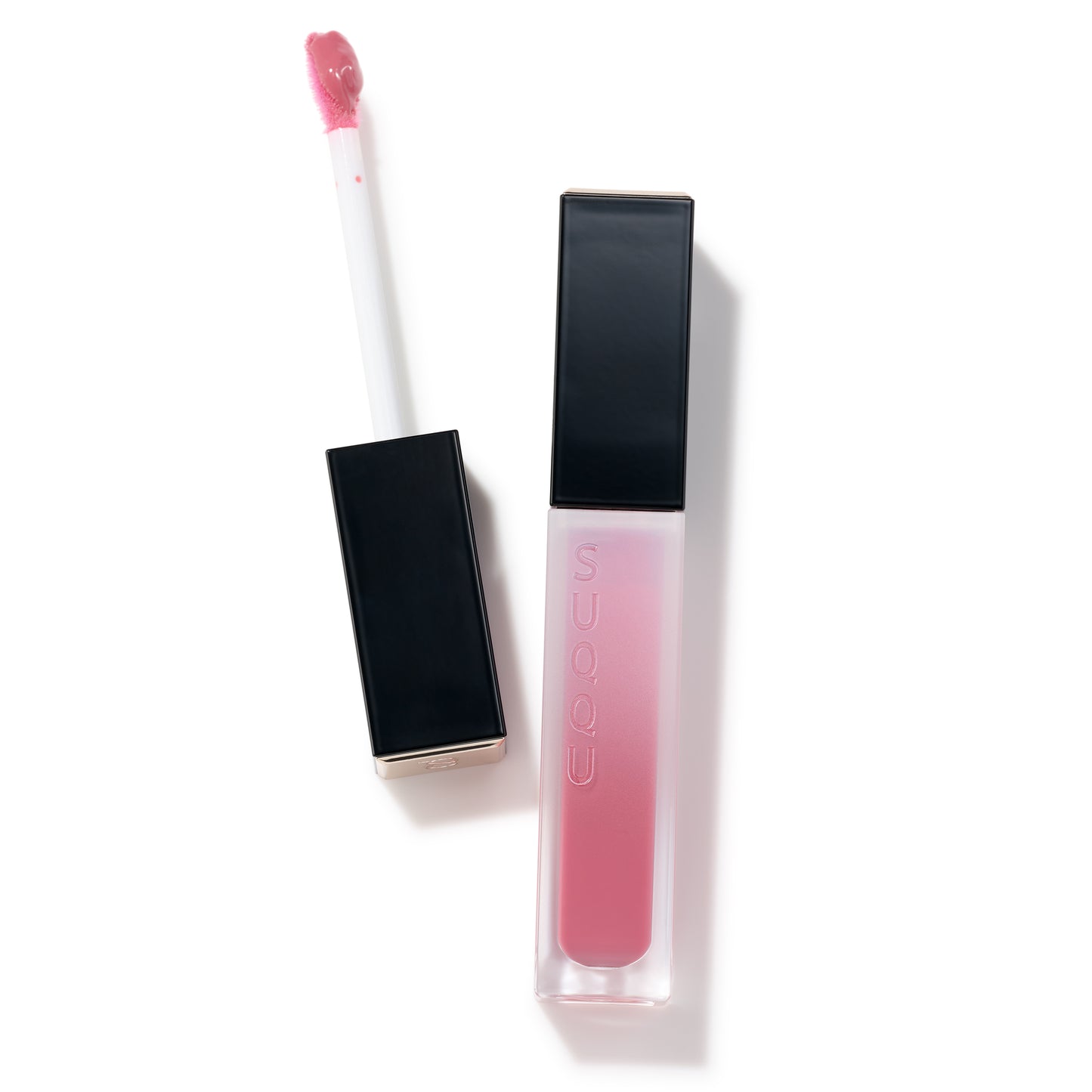 SUQQU Treatment Wrapping Lip 06 beautiful pink juicy lip gloss showing with wand open and package closed.