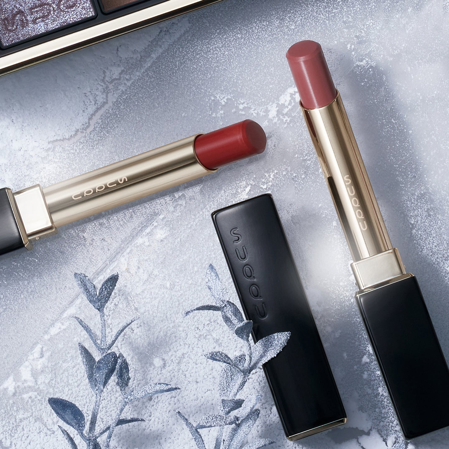 SUQQU Winter Collection 2025 lipsticks on frosted background.