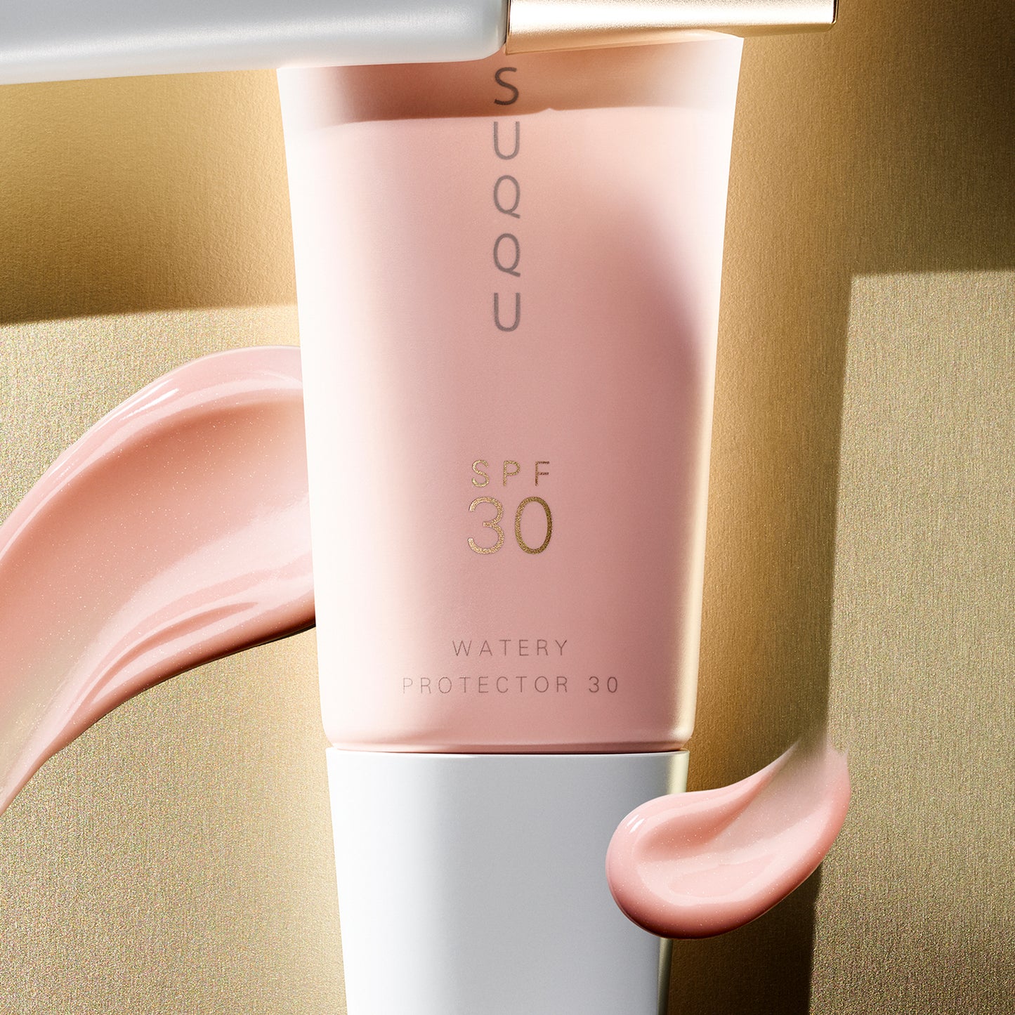 SUQQU Watery Protector 30 product tube close up with texture swatch