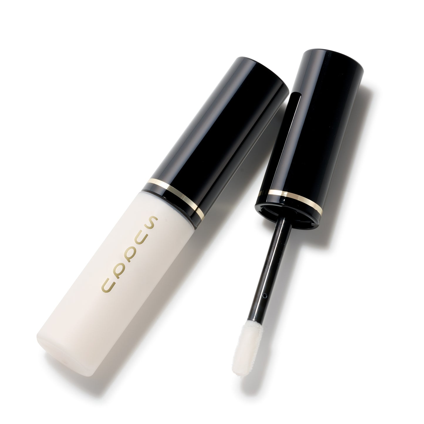 SUQQU Eye Enhancing Primer eye make up product for eyeshadow on plain background with cap off showing wand.