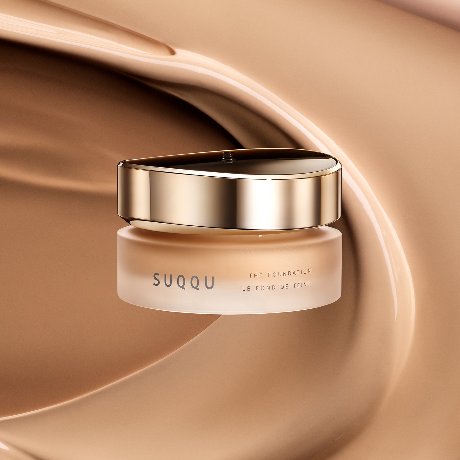 The Cream Foundation product with cream texture background