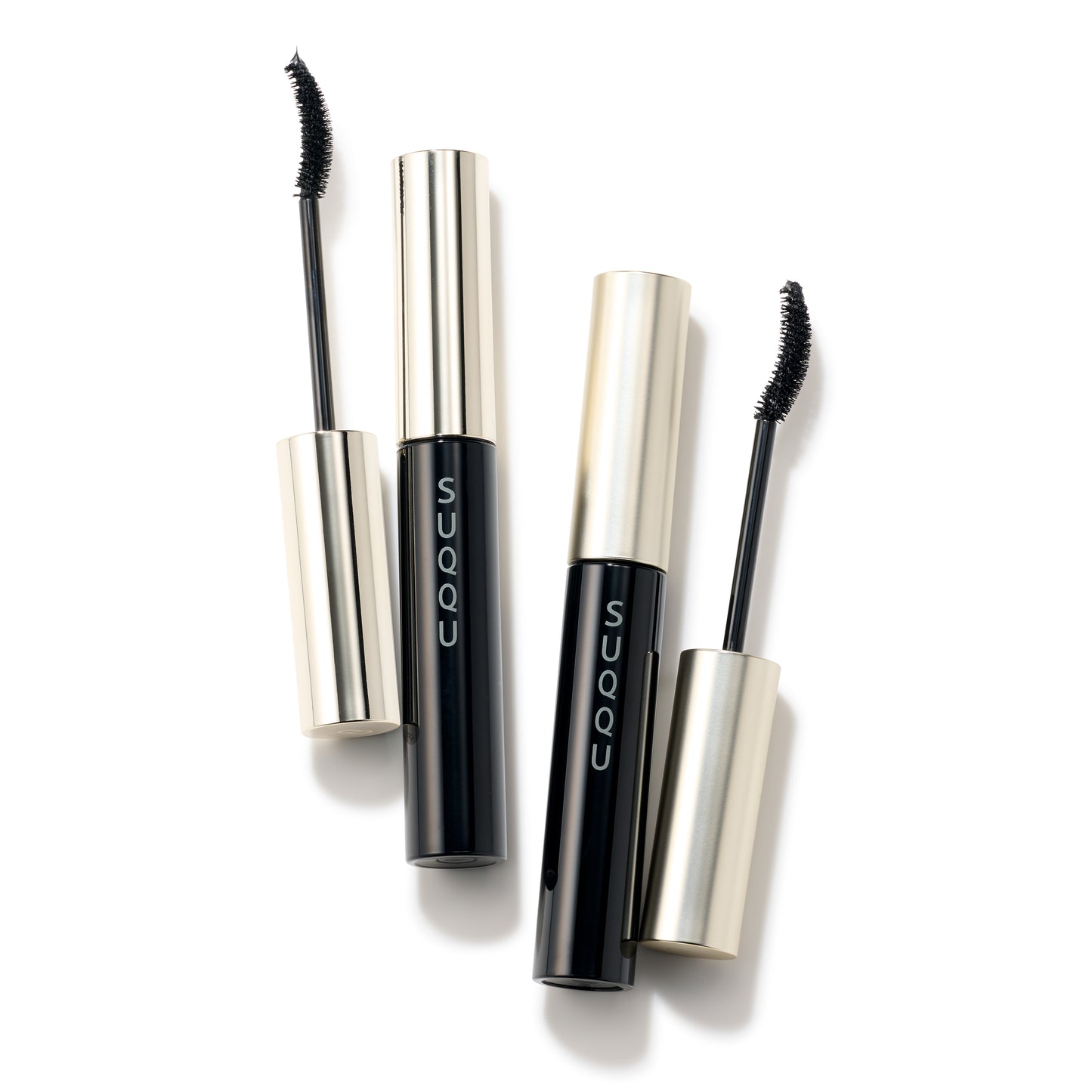 Two SUQQU 3D Eyelash Mascara regular and waterproof black colour products for longer lashes closed and open with wand on plain background