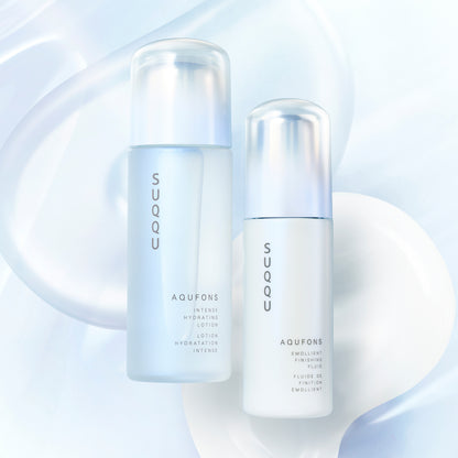 SUQQU Aqufons Intense Hydrating Lotion and Aqufons Emollient Finishing Fluid skincare moisturiser pump bottles on blue background with liquid and cream texture swatches.