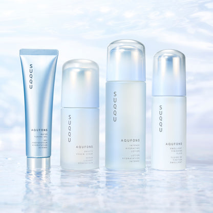 Four skincare products from SUQQU's 'Aqufons' range standing in a line on watery background. Gel, serum, lotion and fluid in pump bottles and tube.