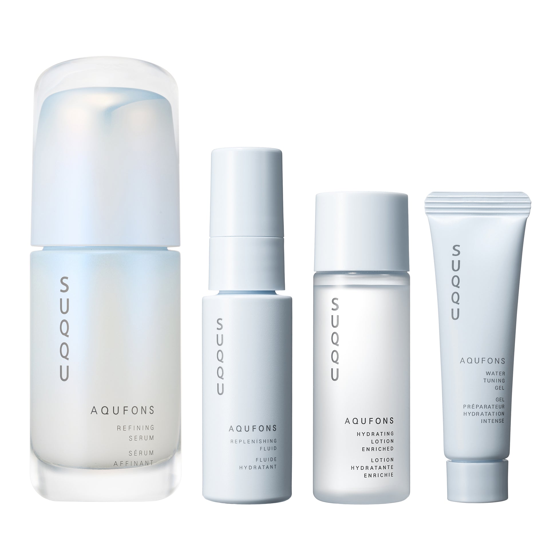 SUQQU Aqufons Refining Serum Kit four luxury Japanese skincare products on a plain background. Serum, lotion, fluid and gel moisturisers.