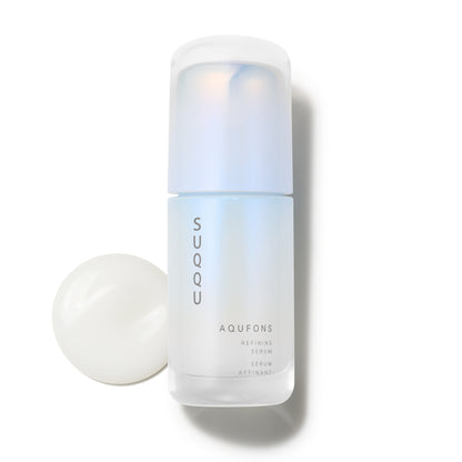 SUQQU Aqufons Refining Serum Kit luxury Japanese skincare product with texture swatch.