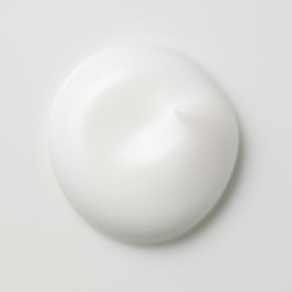 SUQQU Aqufons Replenishing Fluid luxury Japanese skincare product liquid swatch texture on plain background.