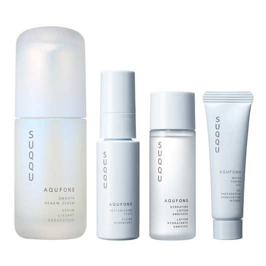 SUQQU Aqufons Smooth Renew Serum Kit four luxury Japanese skincare products on a plain background. Serum, lotion, fluid and gel moisturisers.
