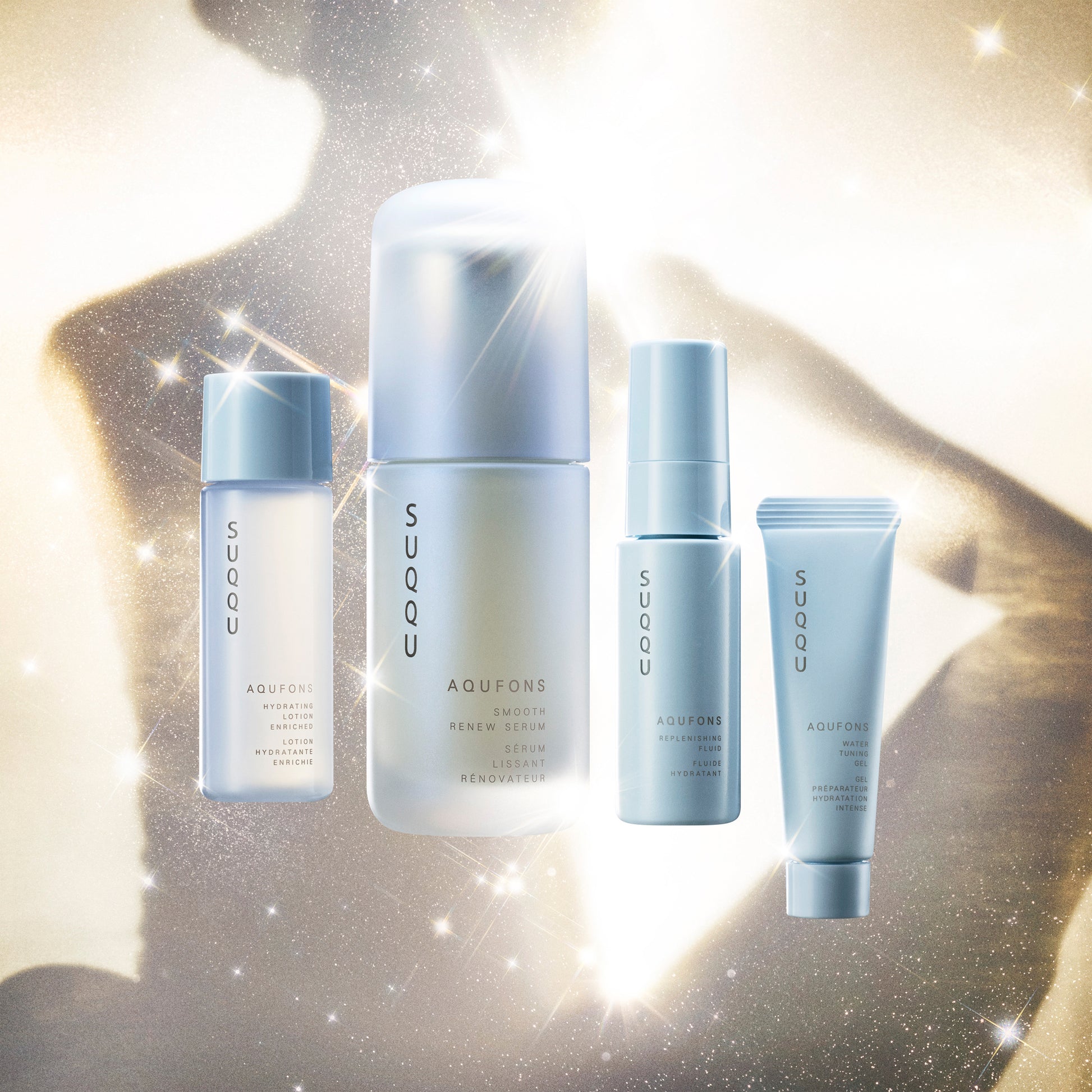 SUQQU Aqufons Smooth Renew Serum Kit four luxury Japanese skincare products on a plain background. Serum, lotion, fluid and gel moisturisers.