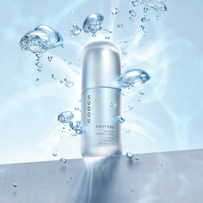 SUQQU Aqufons Smooth Renew Serum luxury Japanese moisturiser skincare product bottle on table with water bubble background.
