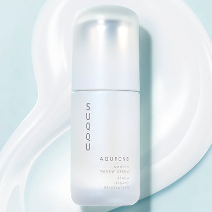 SUQQU Aqufons Smooth Renew Serum skincare bottle with creamy texture background.