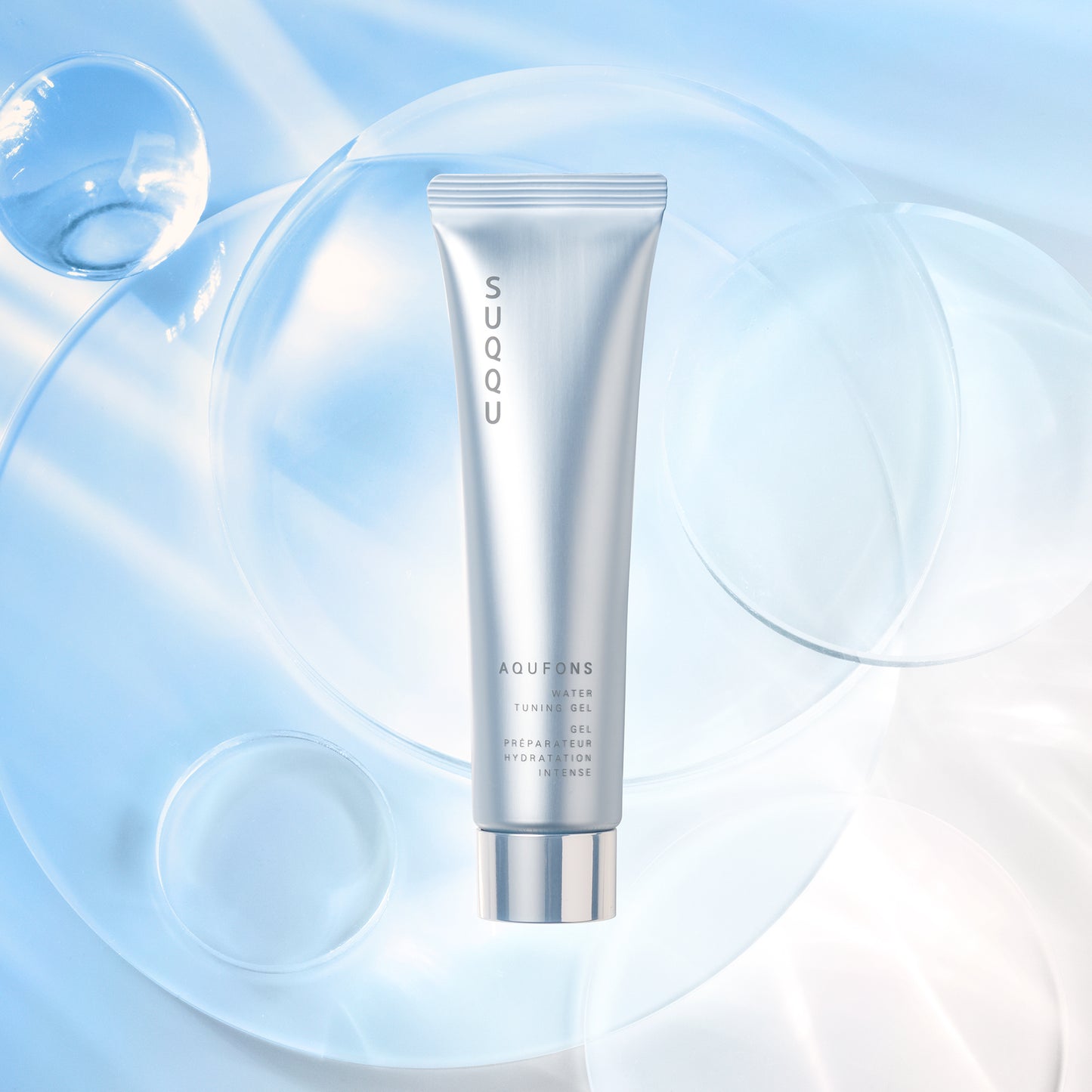 SUQQU Aqufons Water Tuning Gel anti-glycation Japanese skincare moisturising tube product on bubble background.