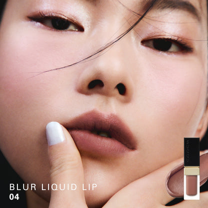 SUQQU Blur Liquid Lip 04 colour swatch shown on portrait of model wearing make up.