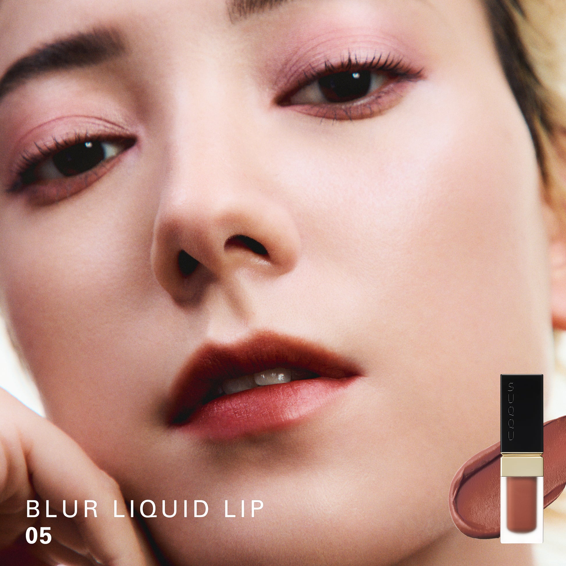 SUQQU Blur Liquid Lip 05 colour swatch shown on portrait of model wearing make up.