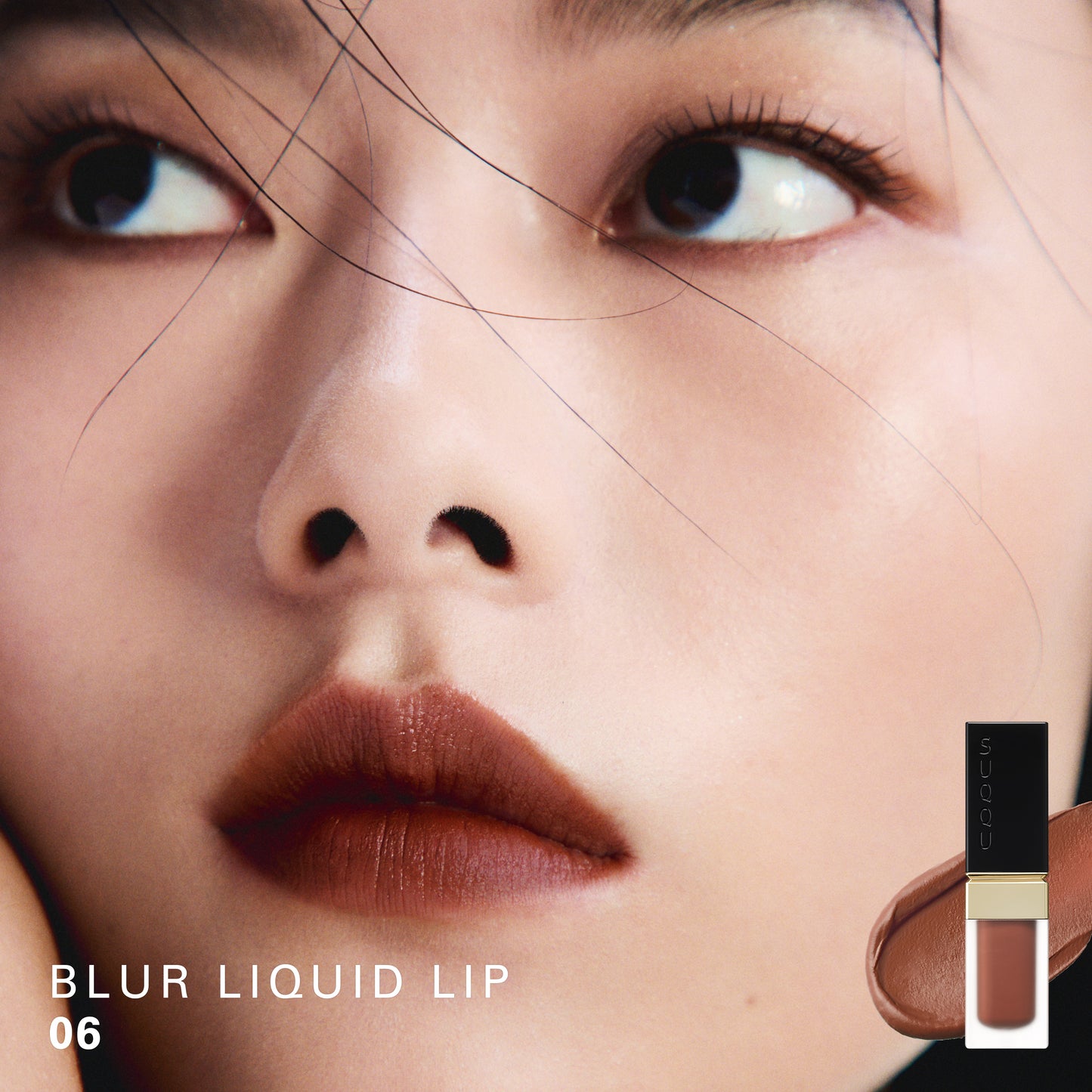 SUQQU Blur Liquid Lip 06 colour swatch shown on portrait of model wearing make up.