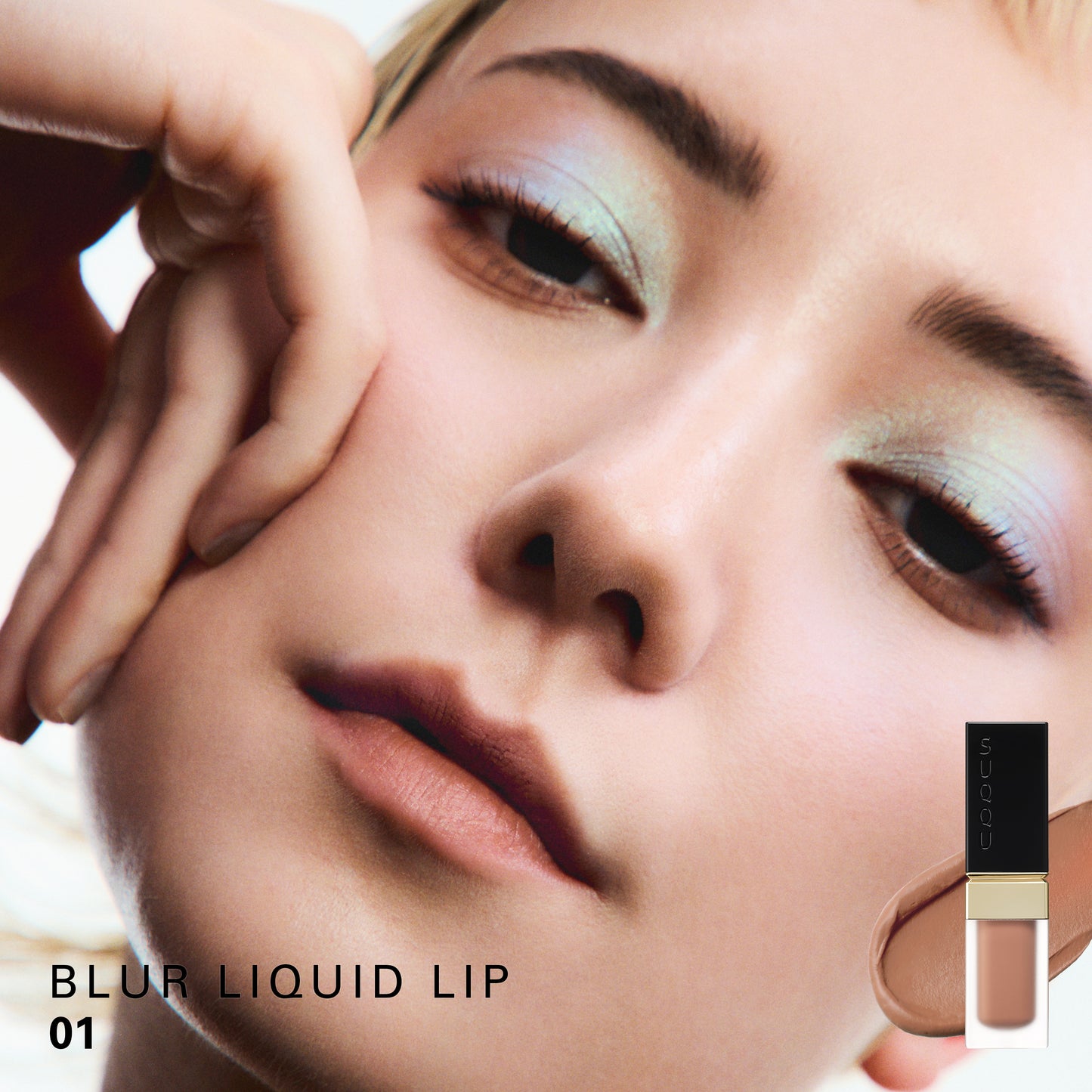 SUQQU Blur Liquid Lip 01 colour swatch shown on portrait of model wearing make up.