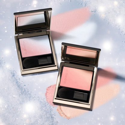 SUQQU Blurring Color Blush 118 & 119 luxury Japanese cosmetic blusher compacts shown with colour texture swatches on frosty background. Shade 118 Soft pink and pale blue highlighter. Shade 119 Coral pink and pale beige pink highlighter.