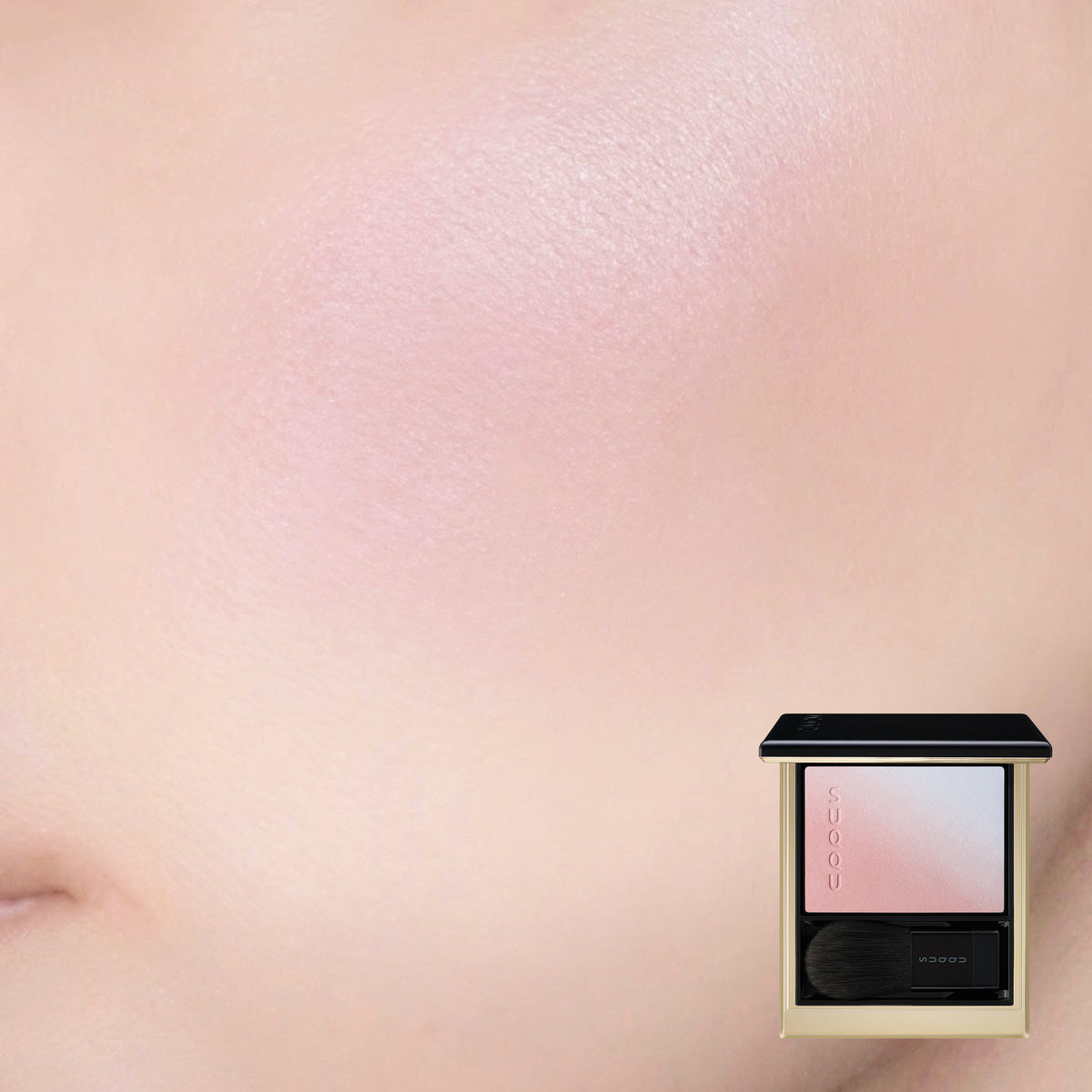 SUQQU Blurring Color Blush 118 luxury Japanese cosmetic blusher compact shown with model cheek wear close up background. Soft pink and pale blue highlighter shades.