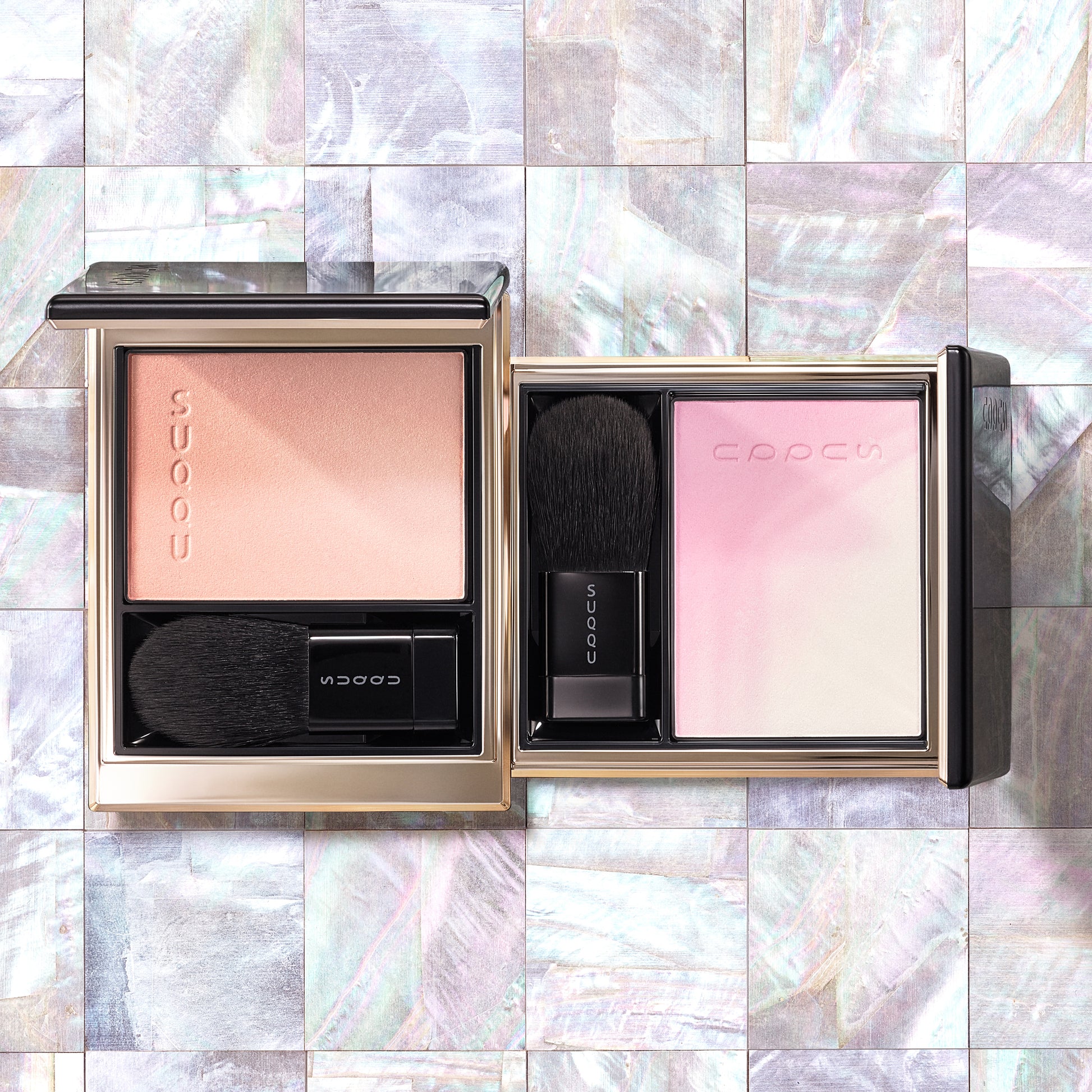 Beautiful SUQQU Blurring Color Blush 09 and 10 cheek blusher and highlighter. Coral with soft beige palette, and Soft pink with pearl white palette on tiled background.