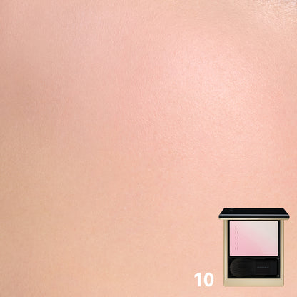 SUQQU Blurring Color Blush 10 cheek blusher and highlighter, soft pink and pearl white colour swatch worn on close up of model's cheek.