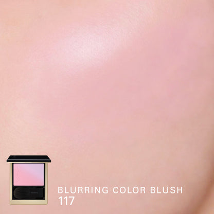 SUQQU Blurring Color Blush 117 gorgeous coral purple and lilac gradiant cheek blusher and highlighter. Colour shown on cheek closeup.