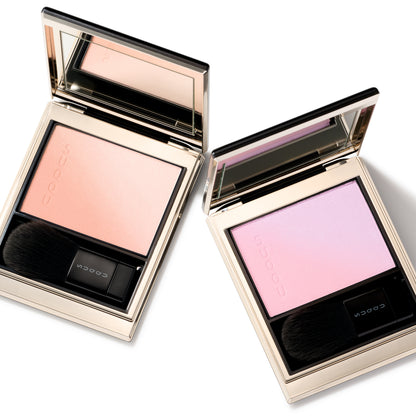 Two SUQQU Blurring Color Blush blushers with orange gold and lilac pink.