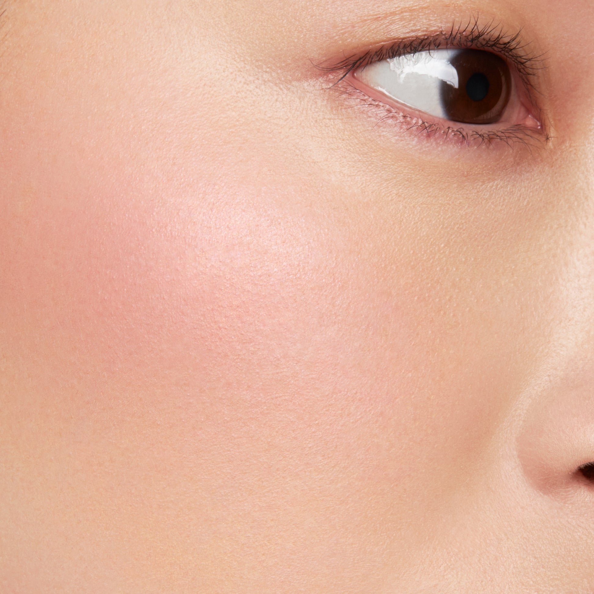 SUQQU Blurring Color Blush close up of blusher make up on model cheek.