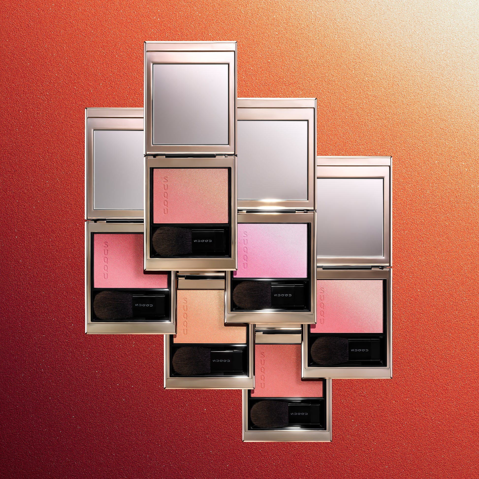 Six colourful SUQQU Blurring Color Blush palettes stacked on colourful textured gradient background.