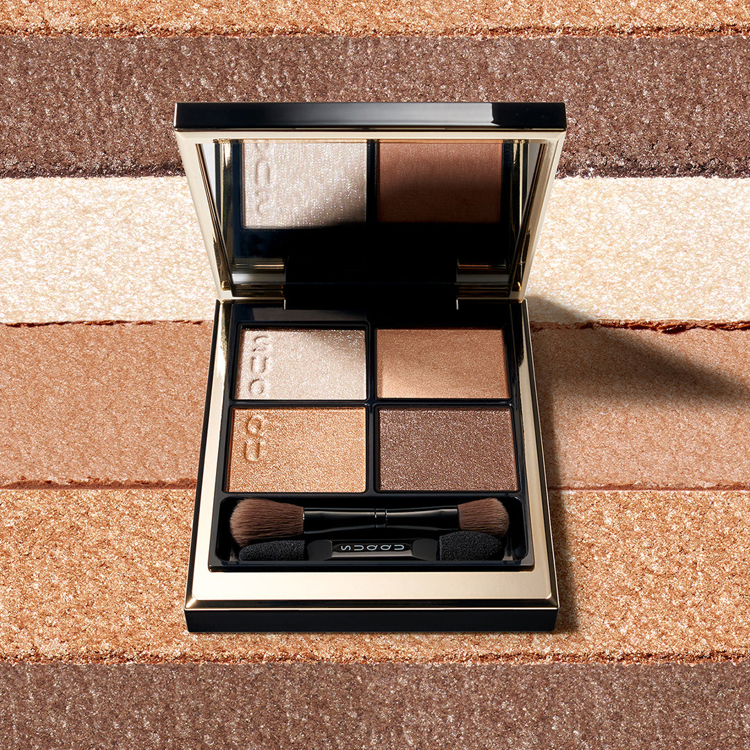 SUQQU Signature Color Eyes 15 brown toned wearable eyeshadow palette opened on colour texture background.