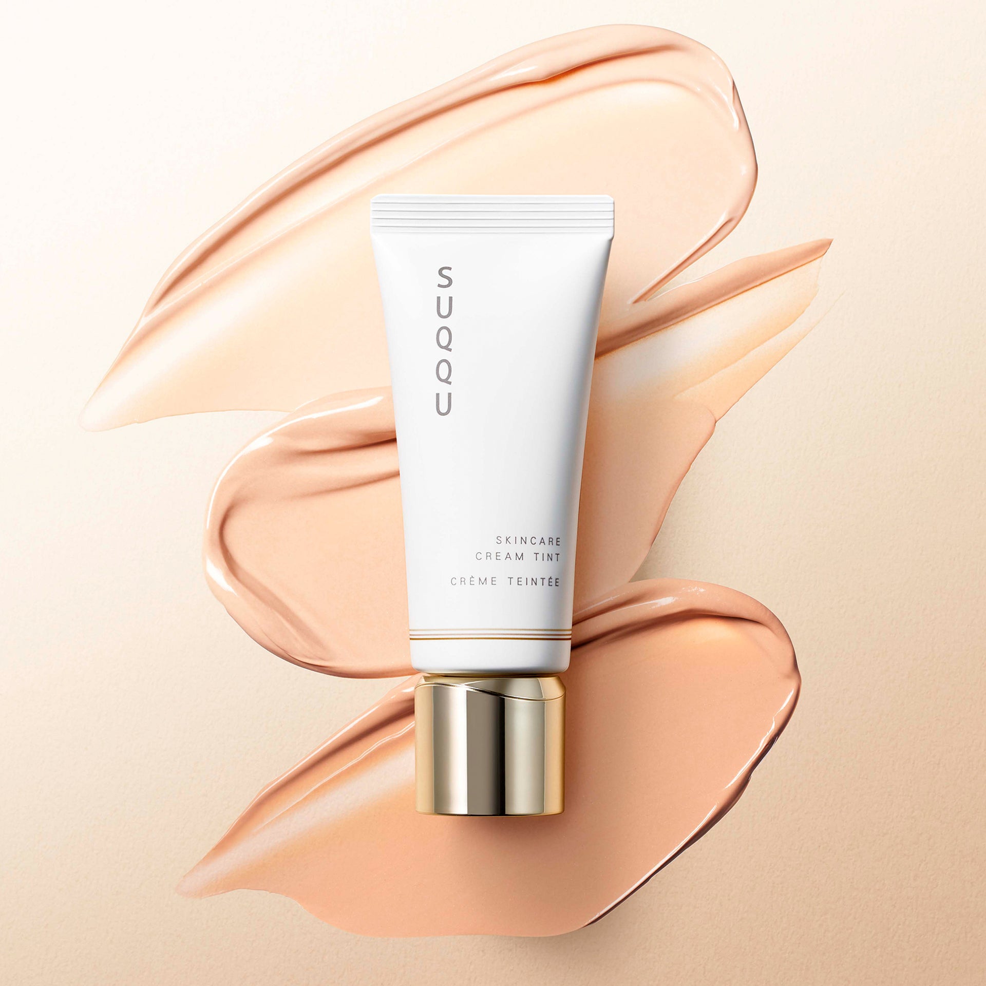 SUQQU Skincare Cream Tint foundation tube with colour texture swatches.